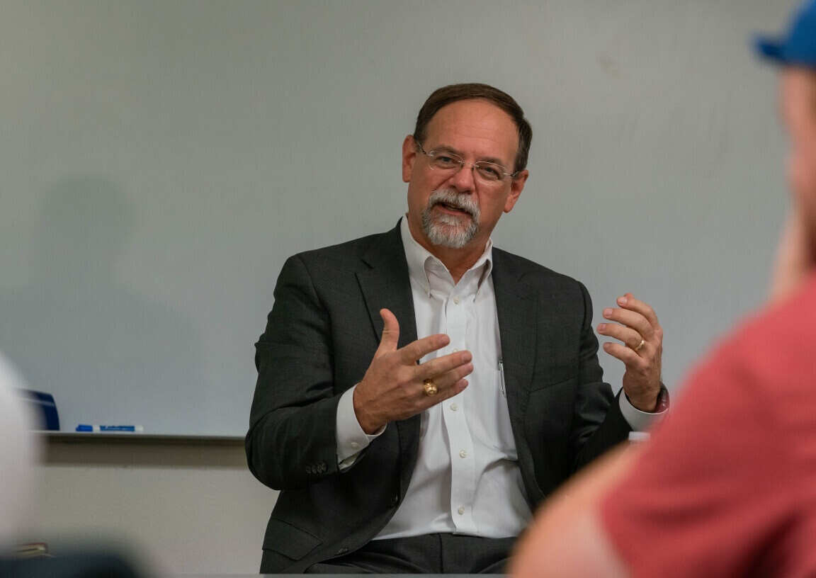 A community business leader presents to a class